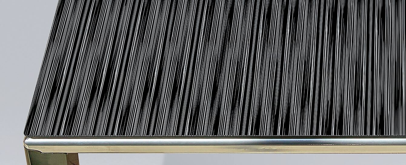 Glass dining top with black-silver decor